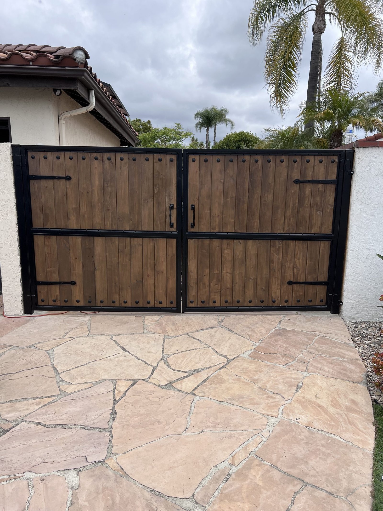 Custom wood and steel driveway gate