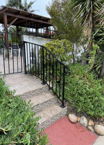 Garden stair handrail with scroll gate